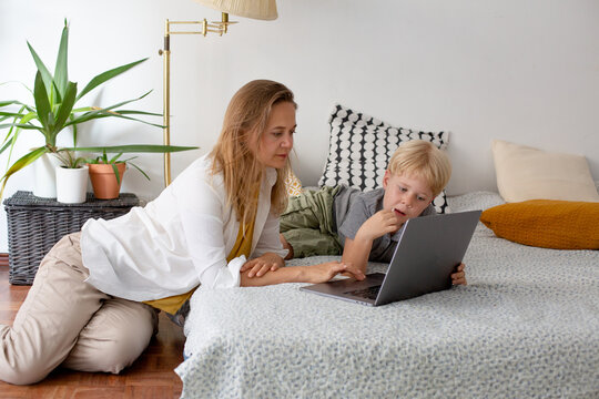 mother and son with laptop