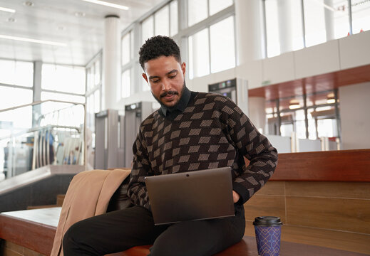 Young businessman works on a laptop