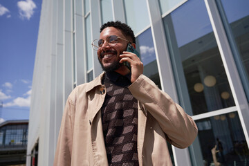 Young Businessman With Smartphone In City