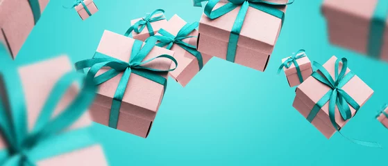 Happy anniversary banner. Group of present, gifts boxes with beautiful blue ribbon flying © olga pink