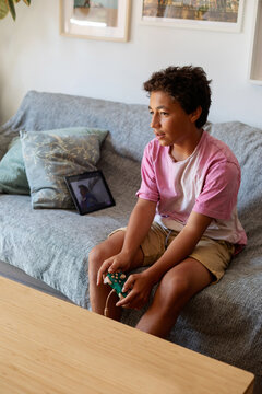 teen boy playing video games
