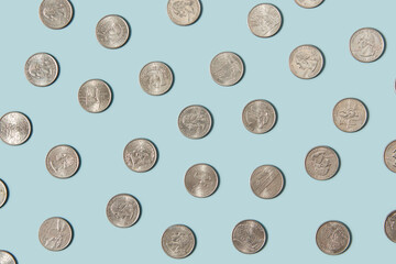 Cent coins laid out on blue background.