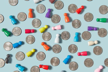 Game pieces of various colors scattered between cent coins.