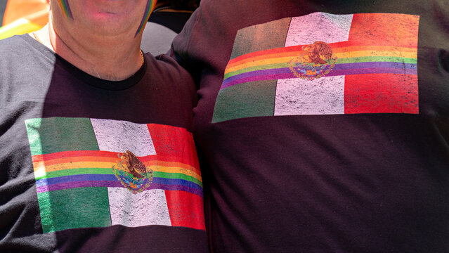 Close Up Of The Shirts Of An Anonymous Couple During The Pride March