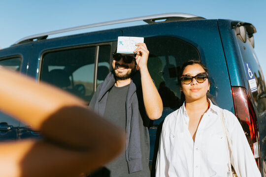 Couple by Van Under Sun