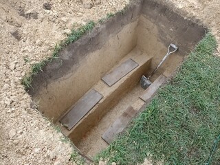 Muslim cemetary newly dug  empty grave hole. Photo taken in Malaysia
