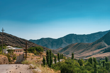 Naklejka premium mountains view from a roadside hill