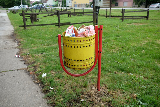 Close up of a garbage can full of garbage