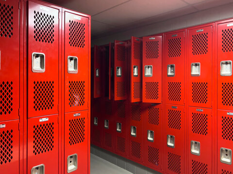 Wall of Red  Lockers in locker room at American High School 