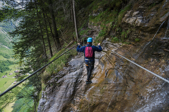 Anonymous Man Crossing Wire Suspension Bridge 