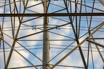 Electrical tower with blue sky and clouds in background