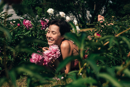 Smiling woman relaxing at the garden