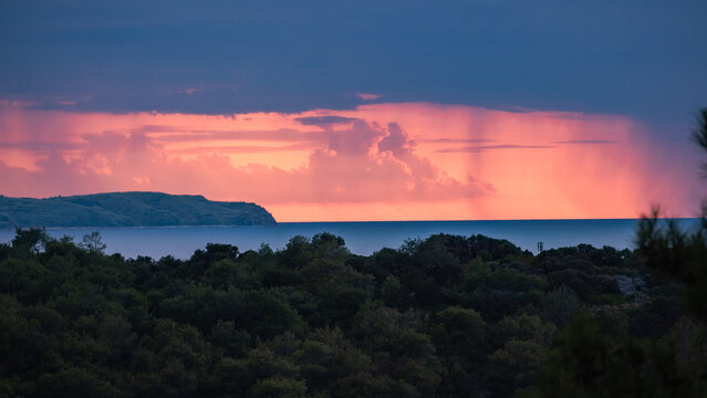 Sunset  with dark  clouds and rain.