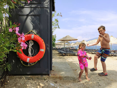 joyful children dancing on the beach


