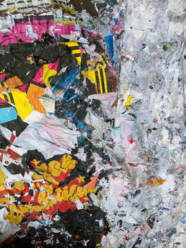 wall with torn posters