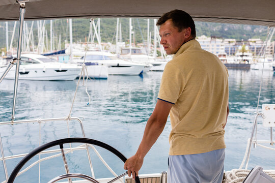 Man enters the marina on a yacht
