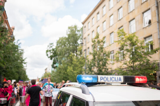 Pride Parade Accompanied By Police Car