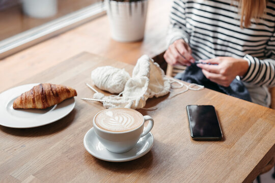 Female knitting breakfast.
