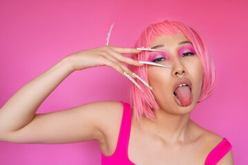 Asian woman with pink hair and trendy nails