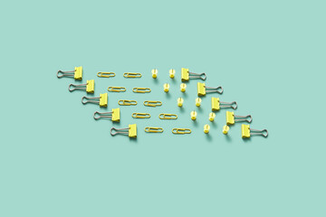 Minimal arrangement of binders, push pins and paper clips.
