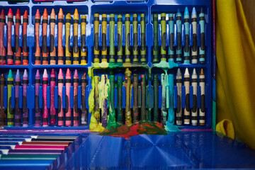 Box of crayons that have melted