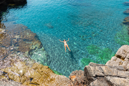 Woman enjoying floating on water