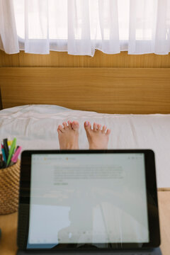 POV woman working on a tablet