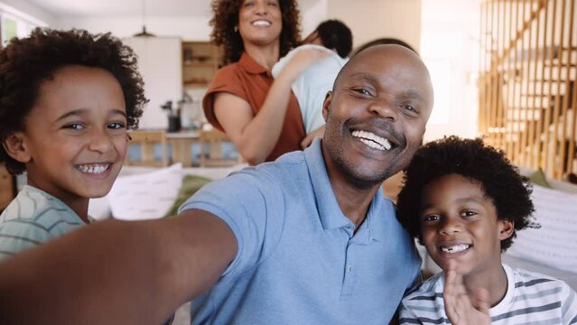 Big mixed race family selfie with the whole family, vlog styled capturing memories of new home renovation and waving at camera 