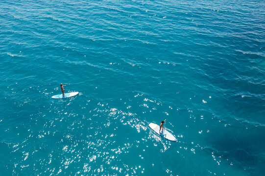 Women exercise on the water