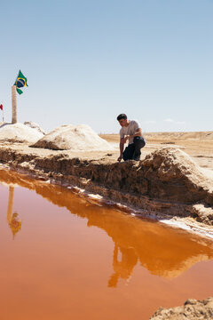Traveler man on the Chott el Djerid salt flat in Tunisia