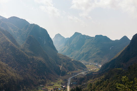 Beautiful landscape of a valley between mountains in Ha Giang, Vietnam - Powered by Adobe