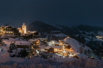 Small mountain town covered in snow