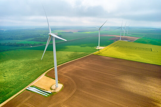 Renewable wind turbines, rapeseed crop for biofuel - energy transition
