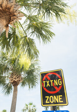 No Texting on Phone Safety Sign in High School Parking Lot