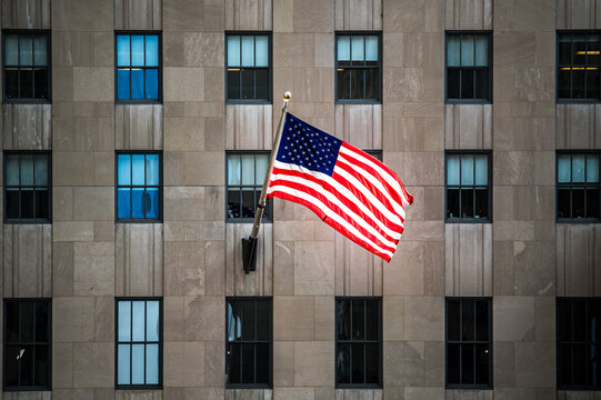 American flag on city building