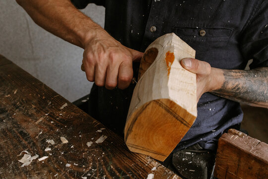 A carpenter in a wheelchair works from home 
