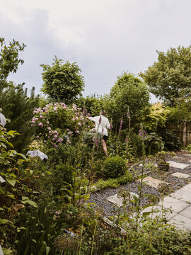Gardener cutting roses in their garden