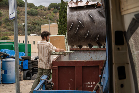 Man dumping furniture at recycling clean point
