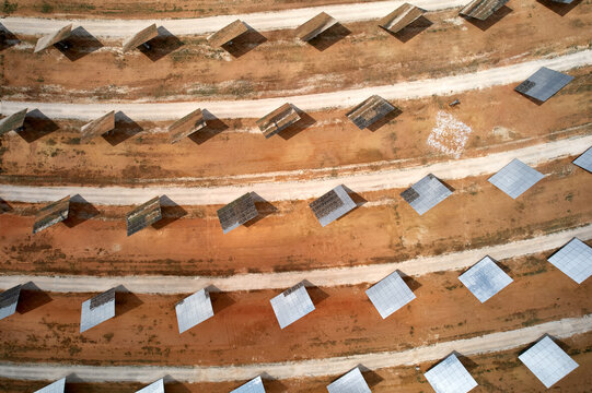 Broken solar panel fragments, heliostat mirror, technological failure