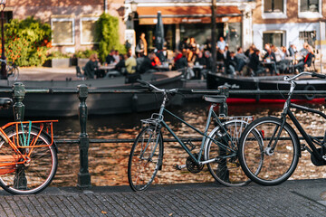Bicycles On Canal In Amsterdam.