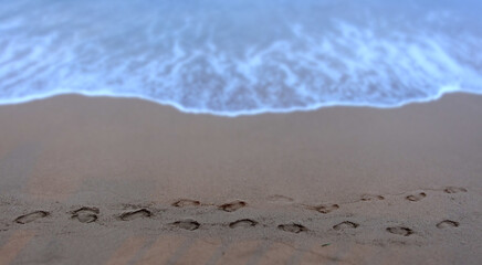 Footprints in the sand on the beach near Front Street, Lahaina, Maui, Hawaii