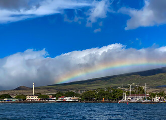 Giant rainbow over the historic town of Lahaina including Front Street and the Pioneer Mill Smokestack, Maui, Hawaii