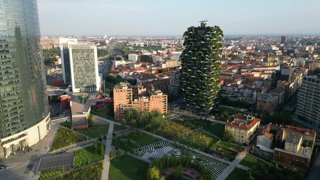 Europe, Italy,Milan 08-18-2023 - drone aerial view of Vertical Forest ( bosco verticale ) luxury skyscraper ecological and sustainable with trees and greenery on the facades in Gae Aulenti new skyline