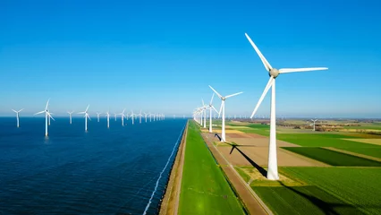 Fotobehang offshore windmill park with clouds and a blue sky, windmill park in the ocean aerial view with wind turbine Flevoland Netherlands Ijsselmeer. Green Energy in the Netherlands © Chirapriya