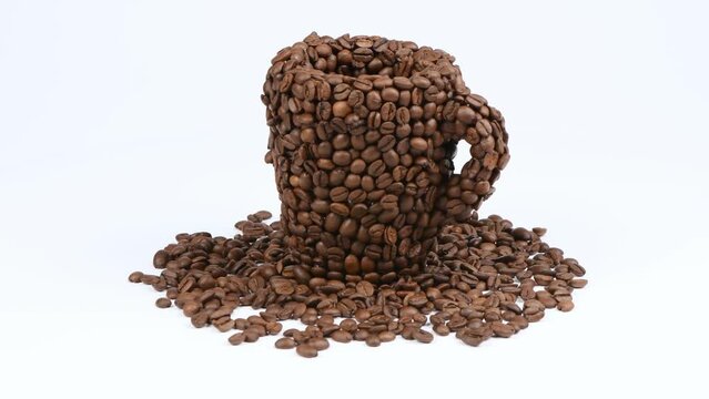 A cup made of coffee beans on white. Side view. Loop motion. Rotation 360. 4K UHD video footage 3840X2160.