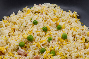 Cantonese Rice in a black dish. Close-up