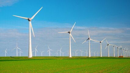 Wndmill park in the ocean aerial view with wind turbine Flevoland Netherlands Ijsselmeer. Green Energy in the Netherlands on a sunny day