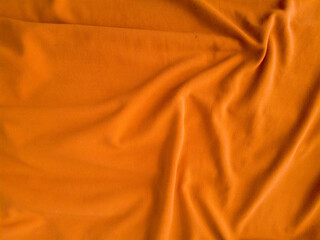 soft orange fabric background, orange backdrop abstract pattern for template, banner design. soft. blurry. satin