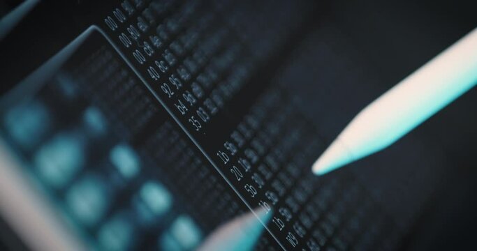 Close-up of user work on tablet screen program code with stylus. Concept of digital work, programming of applications