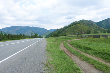 Fototapeta na wymiar rural road in the mountains. Altai, Siberia, Russia